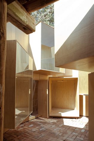 Cube rooms designed from plywood and glass