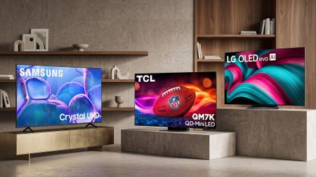 A selection of Samsung, TCL and LG TVs in a room.