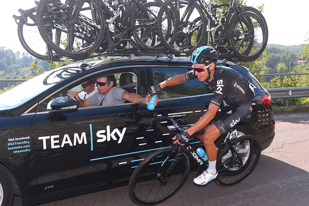 Diego Rosa gets a bottle from the team car