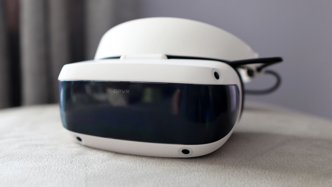 DPVR E4 virtual reality headset with controllers from various angles.
