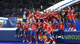 Spain players celebrate with the European Championship trophy after beating England in the final of Euro 2024.