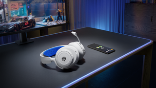 white headphones on a black desk