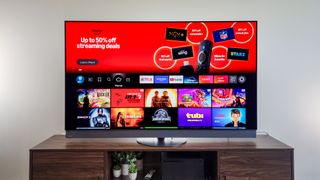 A Panasonic Z95B OLED TV on a side table.