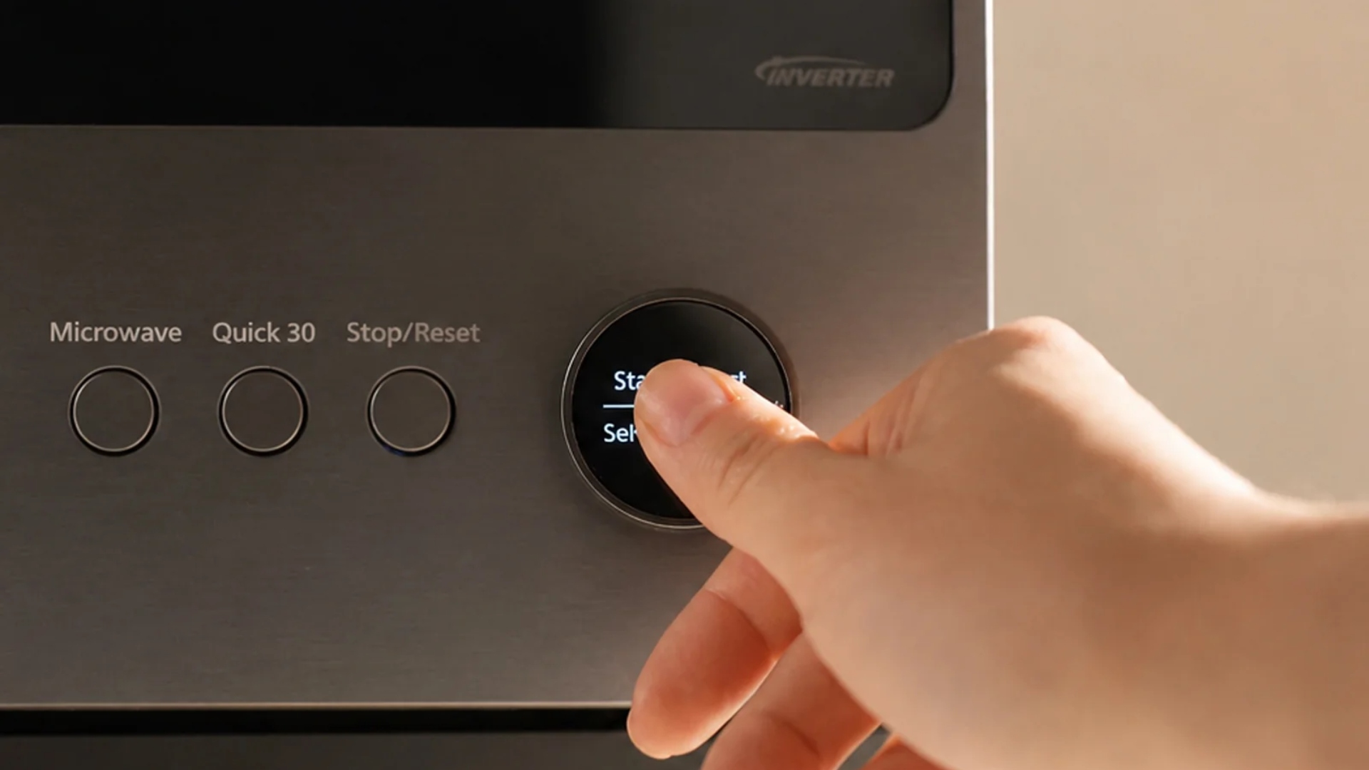Pressing the one-touch button on the Panasonic Japanese Microwave