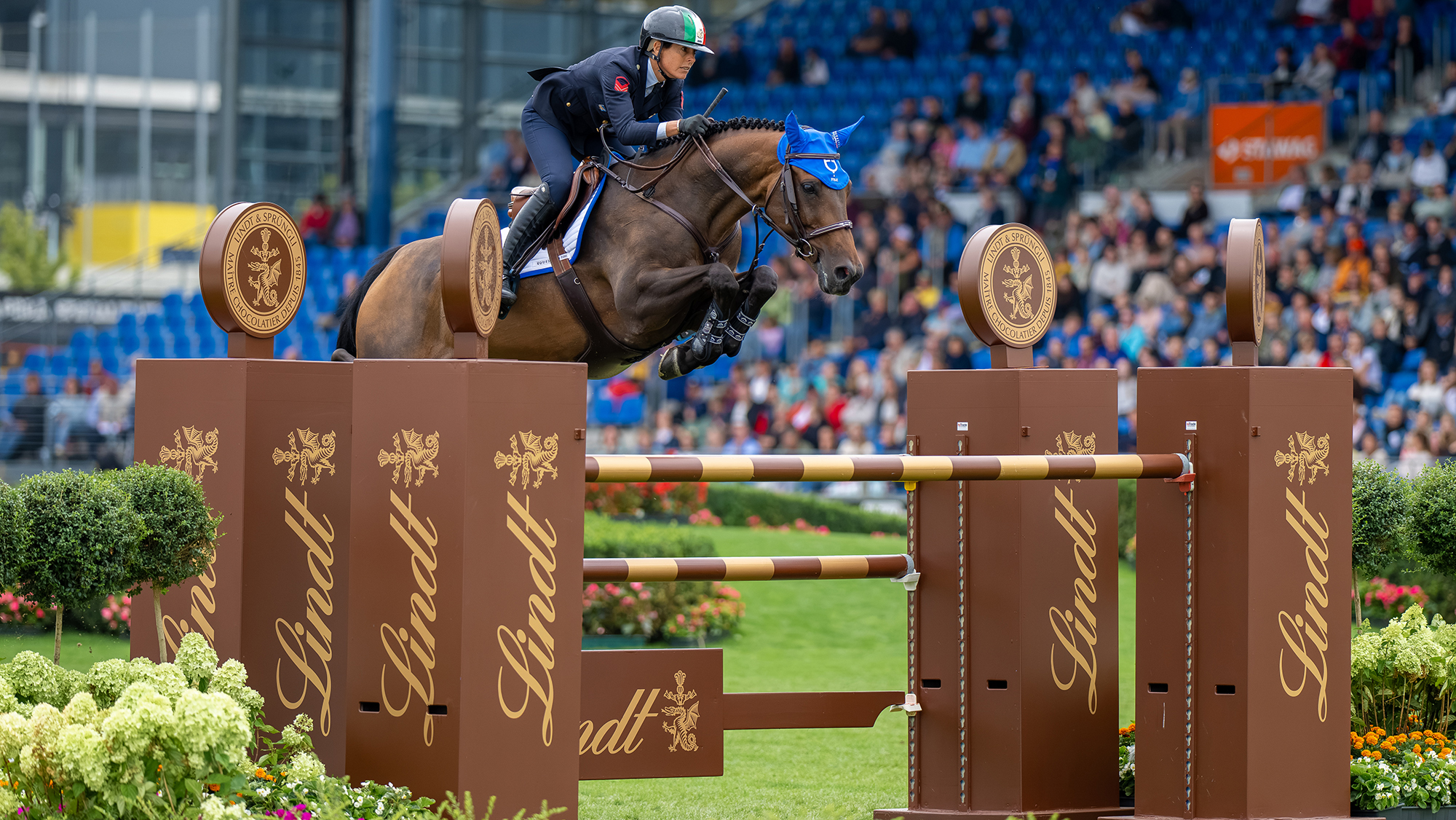 Giulia Martinengo Marquet and Delta Del&amp;rsquo;Isle jump a brown Lindt chocolate fence at the showjumping World Championships in Aachen