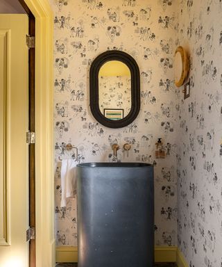 Powder room with blue sink and yellow ceiling