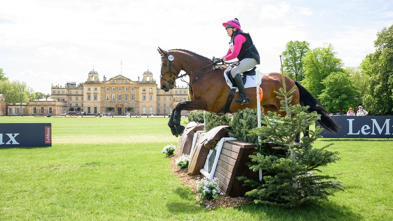 Holly Jessett and Lombard Lad jump a cross-country fence in front of Badminton House on the way to topping the Badminton grassroots results at BE90 in 2026.