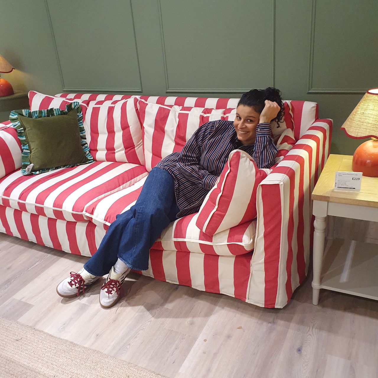 Sara sitting on the John Lewis x Sophie Conran Cocobella sofa