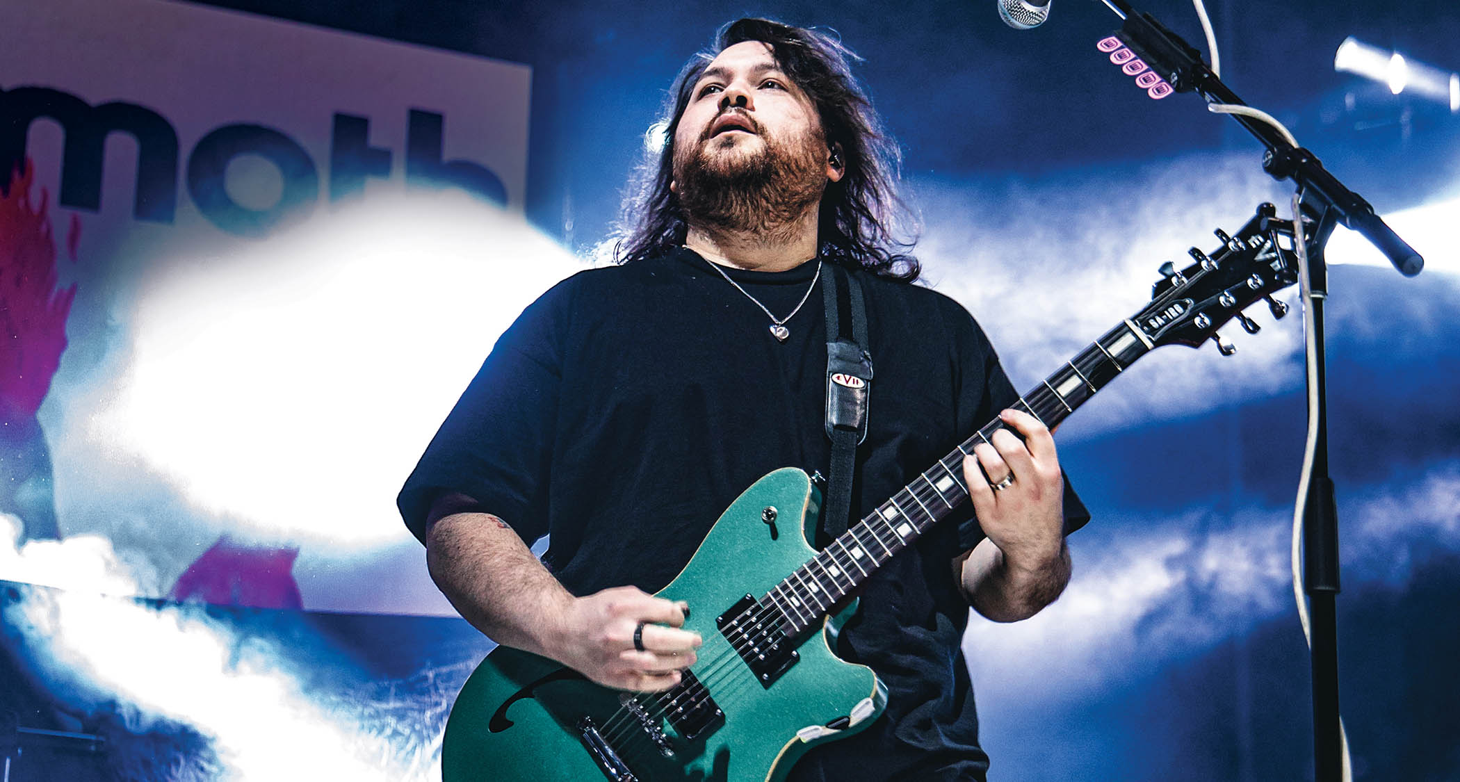 Wolfgang Van Halen performs live with his signature EVH semi-hollow in green.