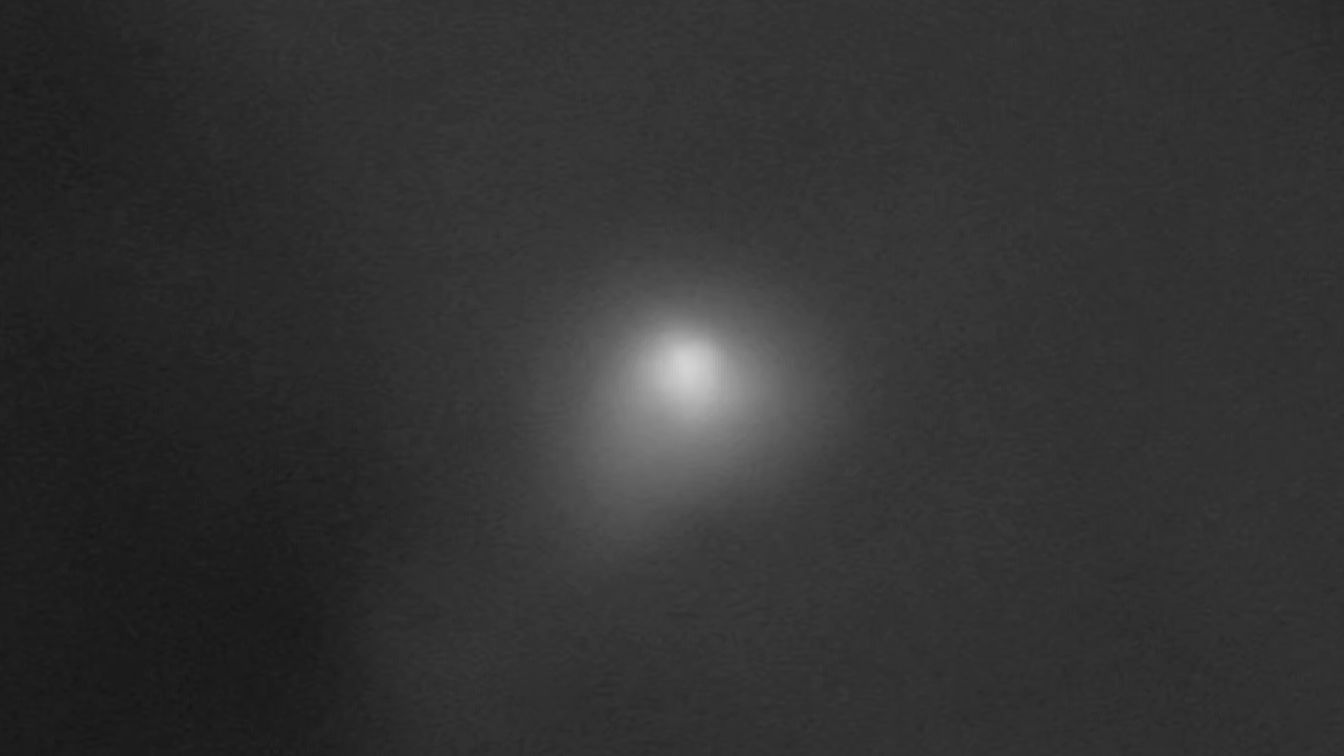 a fuzzy white blob on a black background