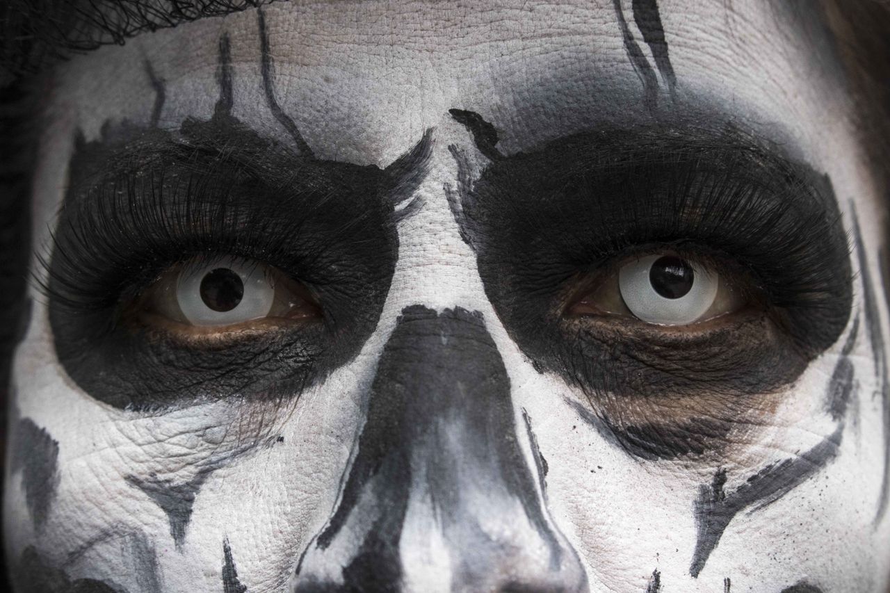 A woman dressed in a catrina costume attends the annual Catrinas Parade in Mexico City.