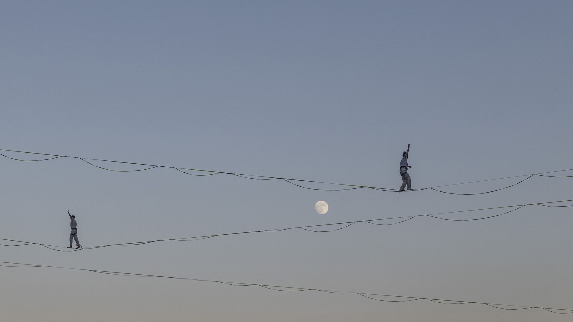 
                                High-wire artists traverse cables suspended above the Hinnom Valley during a dress rehearsal for the 65th Israel Festival in Jerusalem, Israel
                            