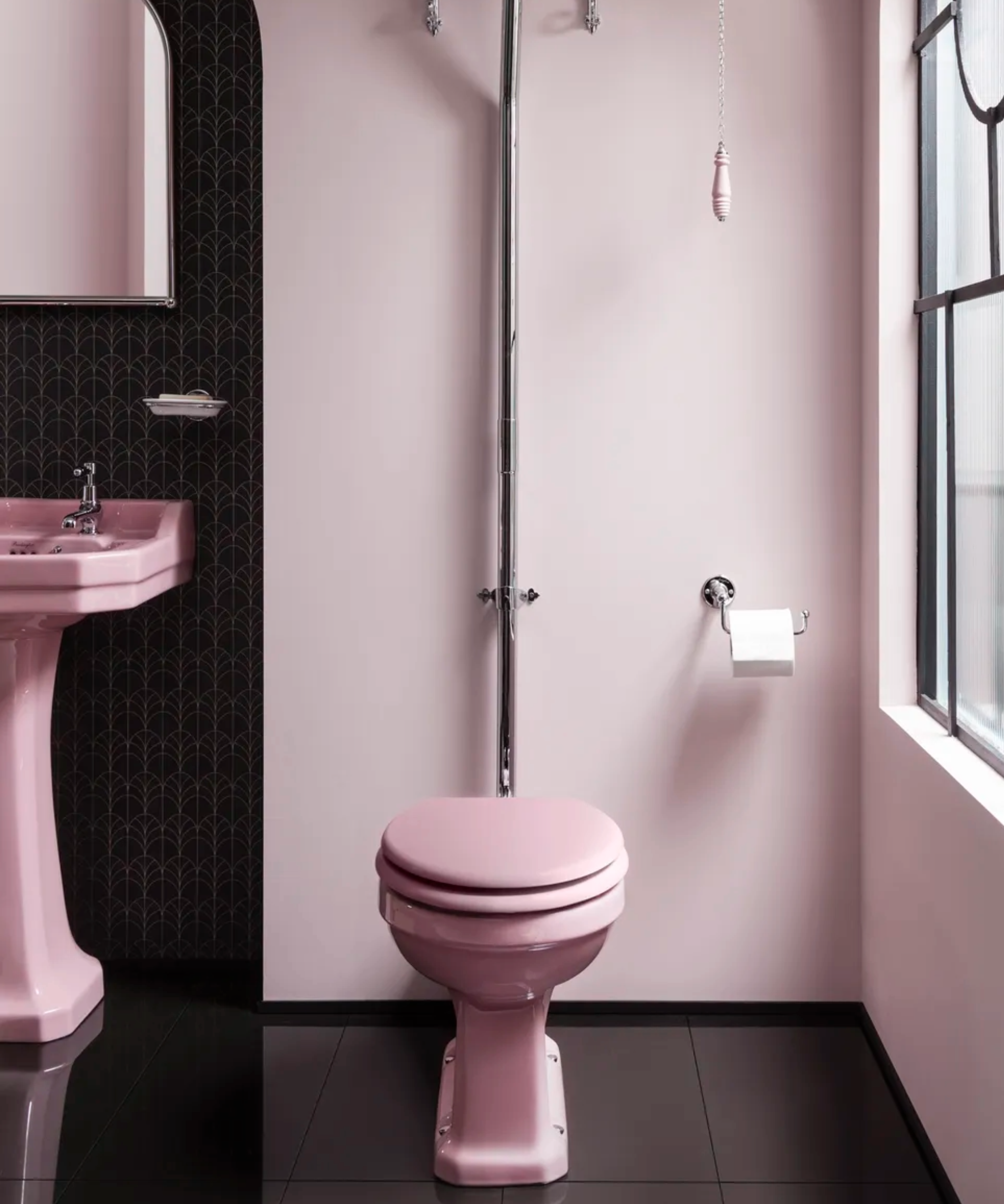 pink toilet and sink in downstairs cloakroom