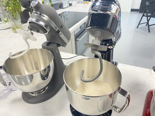 KitchenAid and Cuisinart stand mixers side-by-side, making bread