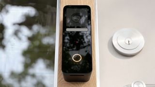 Logitech Circle Video Doorbell installed near a door