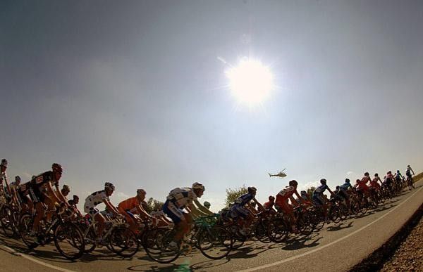 The hot summer sun beats down on the weary peloton