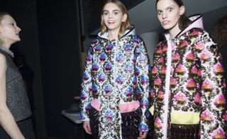 2 female models in patterned coats