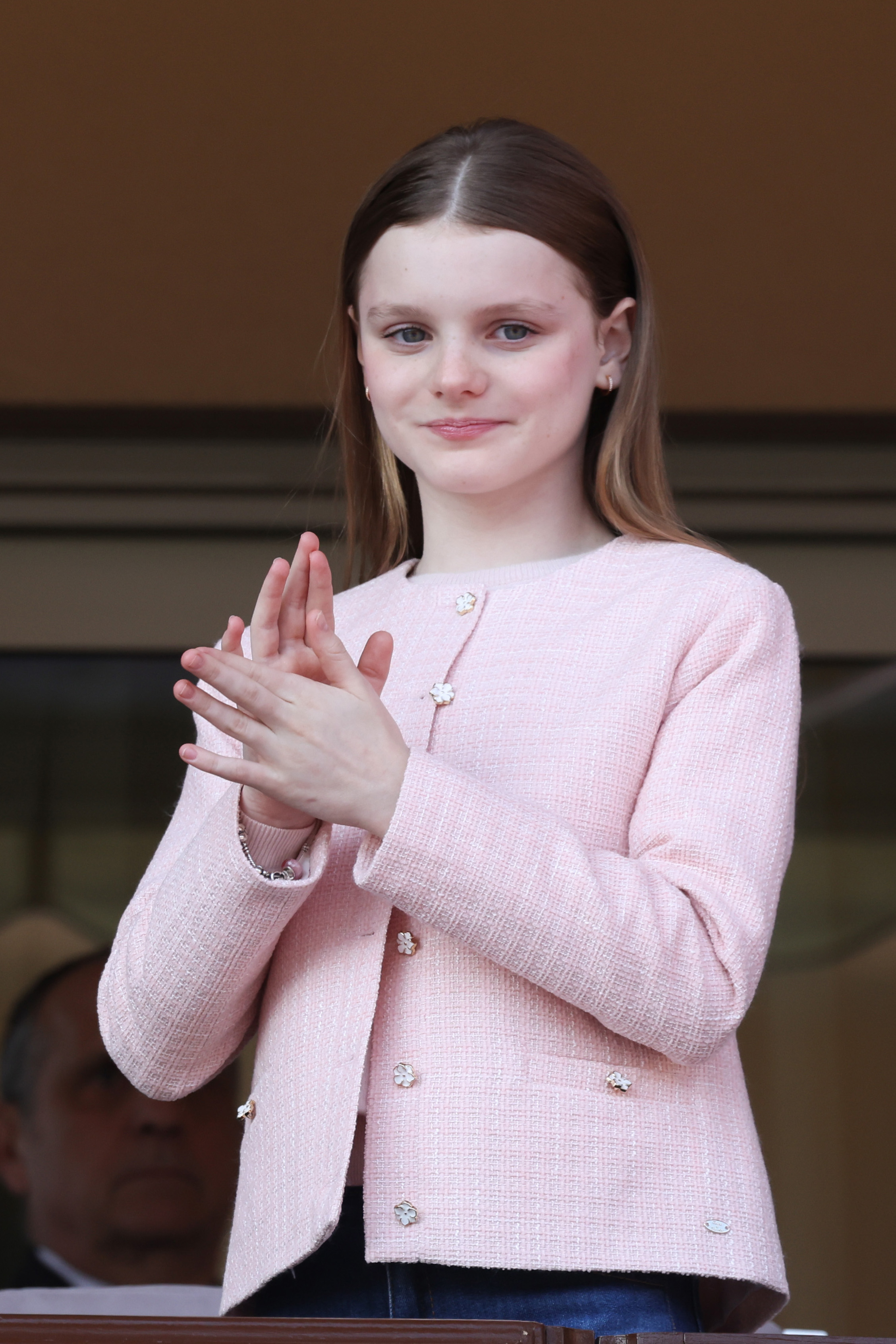 Princess Gabriella wearing a pink blazer and clapping
