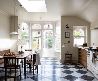 kitchen diner with variety of lighting plus french doors, skylights and table lamps