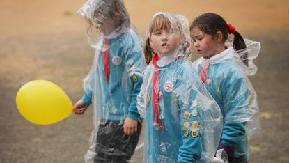 LONDON, ENGLAND - NOVEMBER 14:Girl Scouts brave the rain in The Lord Mayor's Show on November 14, 2009 in London. The Lord Mayor's Show processes through three miles of London's streets with 