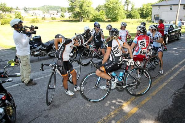Riders in the women's break are stopped after the field got off course.