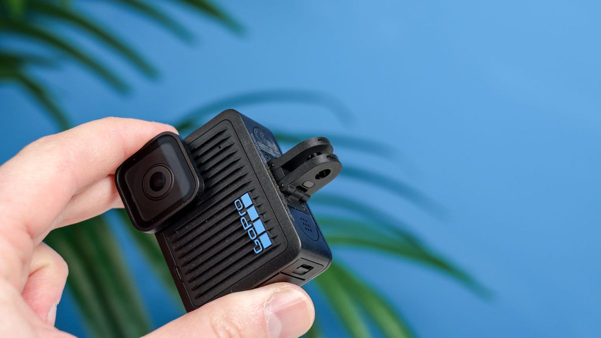 The GoPro Hero (2024) in hand with its forks folded out