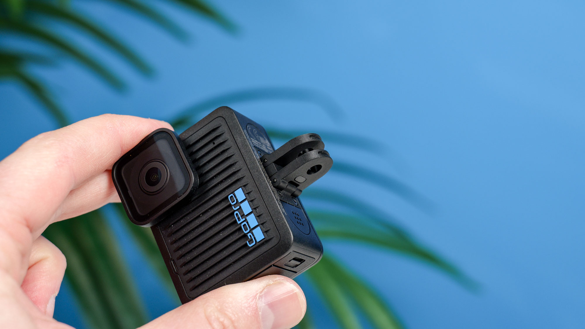 The GoPro Hero (2024) in hand with its forks folded out