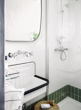 shower room with green tiles