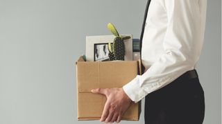 Fired worker with packed box