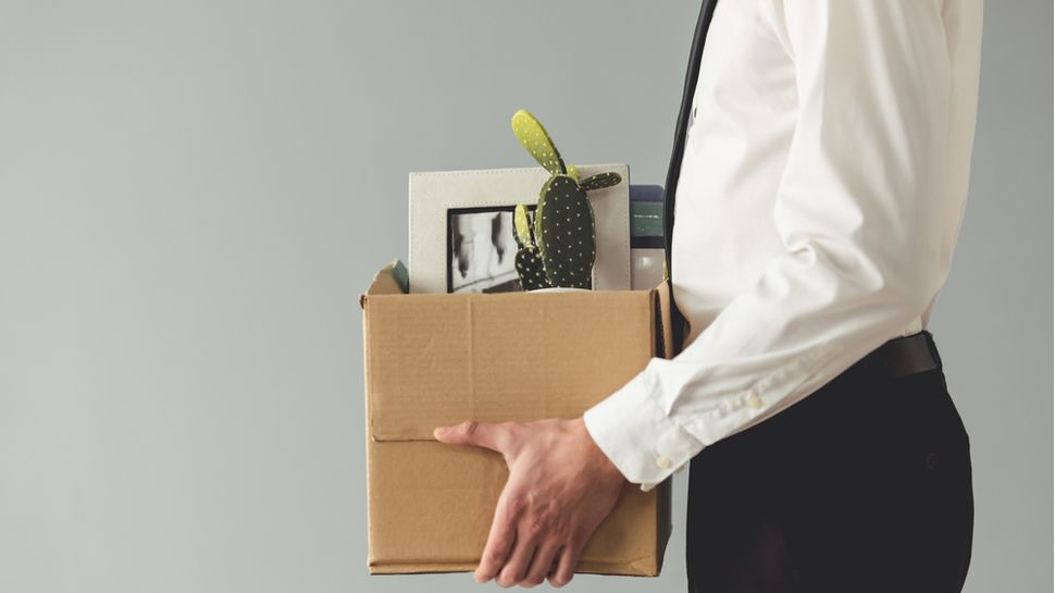 Fired worker with packed box