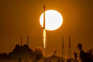 Backdropped by the rising sun, a SpaceX Falcon 9 rocket launches a GPS III rocket on behalf of the United States Space Force on Jan. 18, 2023.