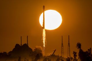 Backdropped by the rising sun, a SpaceX Falcon 9 rocket launches a GPS III satellite on behalf of the United States Space Force on Jan. 18, 2023.