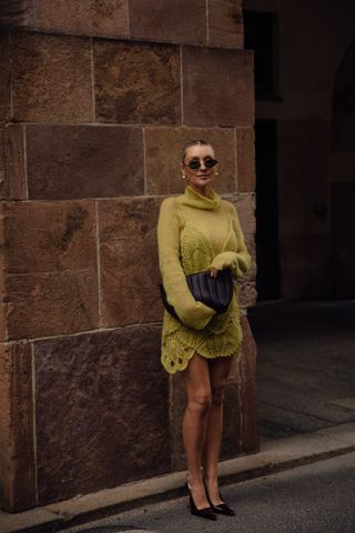 woman wearing green mini dress and heels