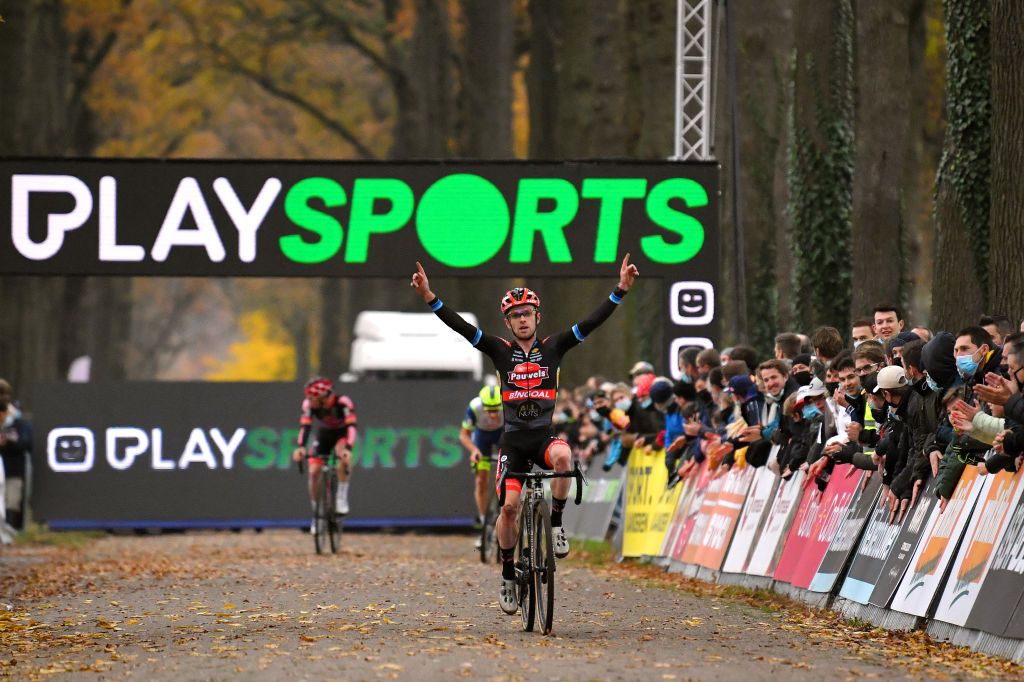 RIJKEVORSEL BELGIUM NOVEMBER 20 Eli Iserbyt of Belgium and Team Pauwels Sauzen Bingoal celebrates winning ahead of Quinten Hermans of Belgium and TormansCircus Cyclo Cross Team and Laurens Sweeck of Belgium and Team Pauwels Sauzen Bingoal during the 35th Superprestige Merksplas 2021 Mens Elite Superprestige2022 SPMerksplas on November 20 2021 in Rijkevorsel Belgium Photo by Luc ClaessenGetty Images