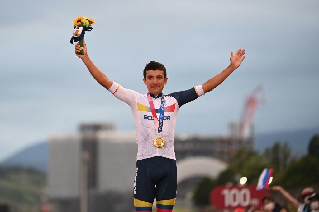 Gold medallist Ecuador&#039;s Richard Carapaz celebrates his victory on the podium during the medal ceremony for the mens cycling road race of the Tokyo 2020 Olympic Games