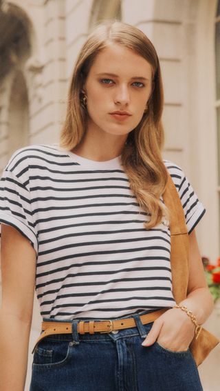 a model wears a short-sleeve striped T-shirt