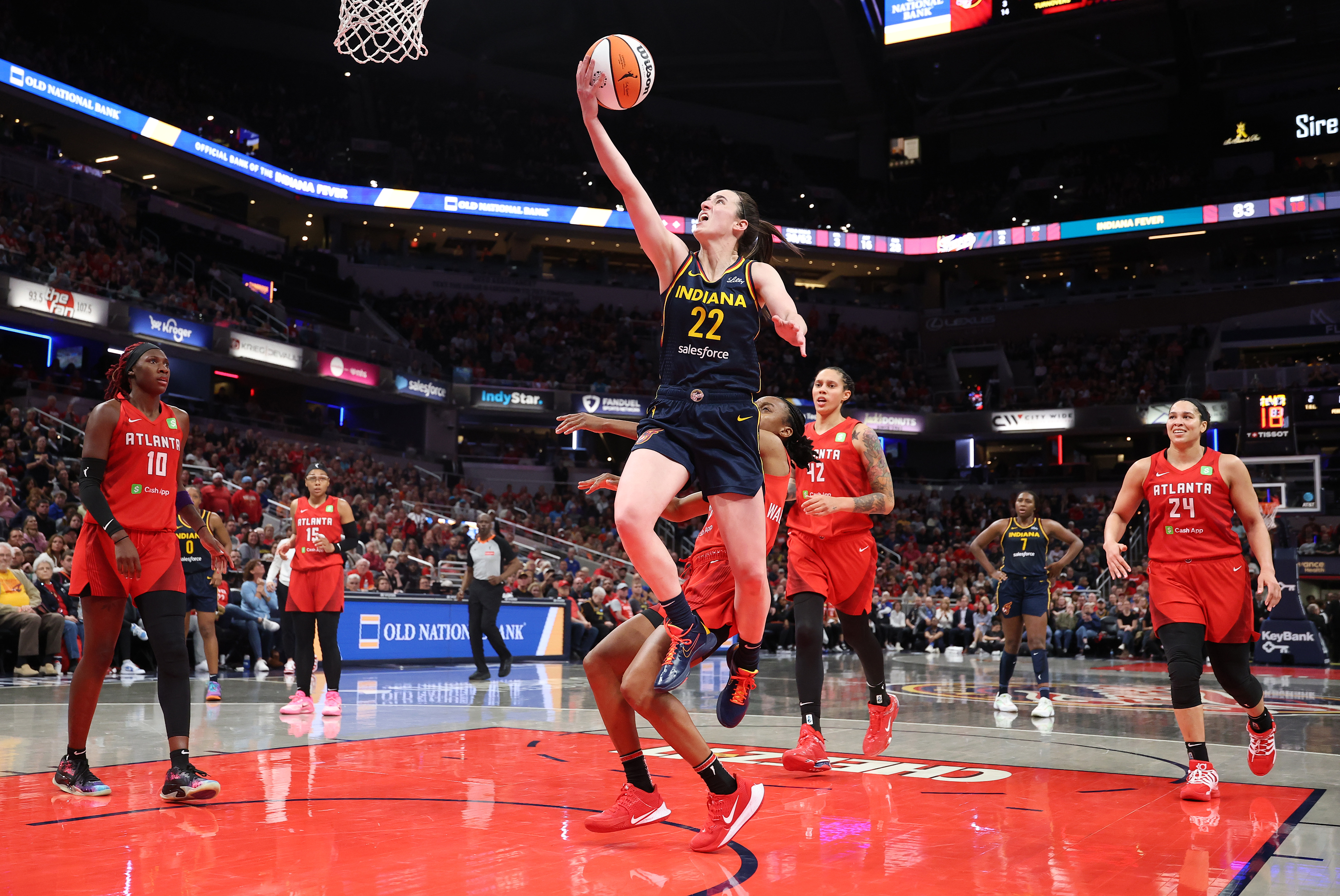 Caitlin Clark jumps at a hoop during her match with Atlanta Dream
