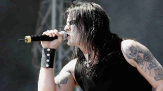 Satyricon singer Satyr performing onstage at Download 2006