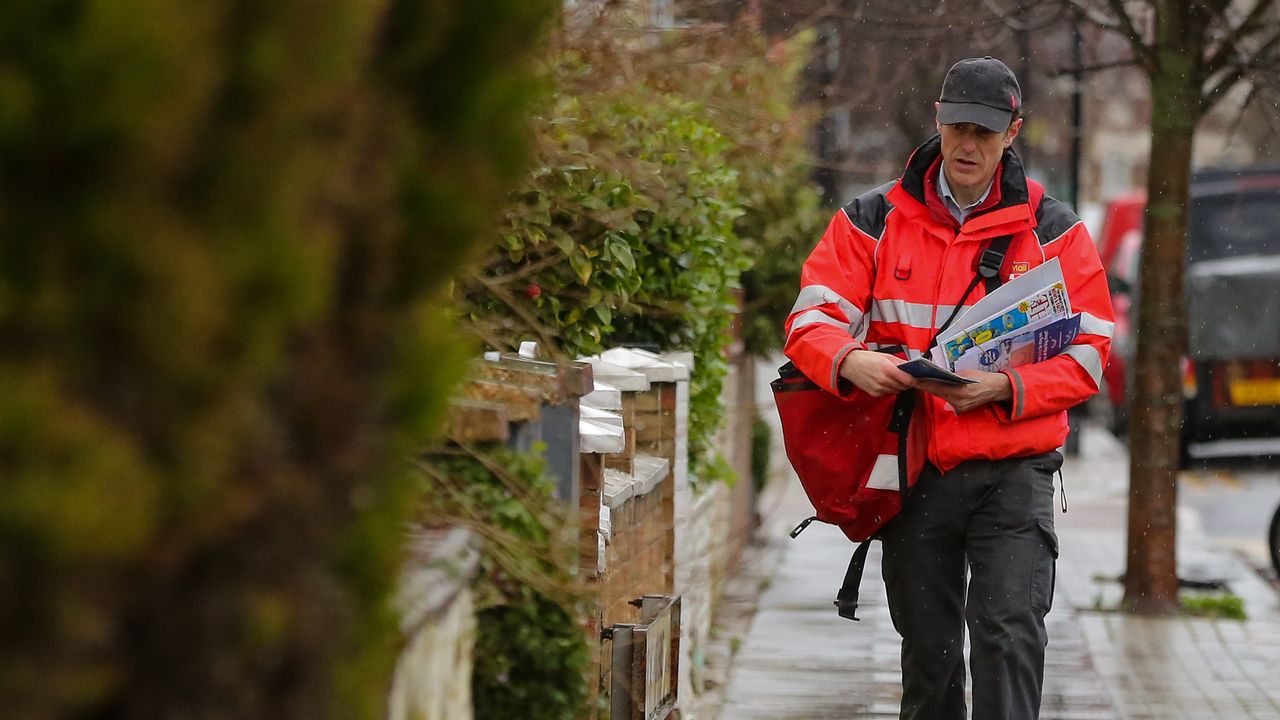 A Royal Mail postal worker