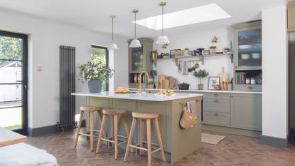 kitchen island with wooden chairs in rustic kitchen
