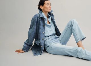 AYR model wearing denim top, denim jacket, and blue jeans