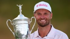 Wyndham Clark holding the US Open trophy