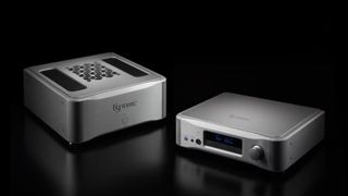 Esoteric N-05XE and S-05XE preamplifier and stereo amplifier in silver on a black background
