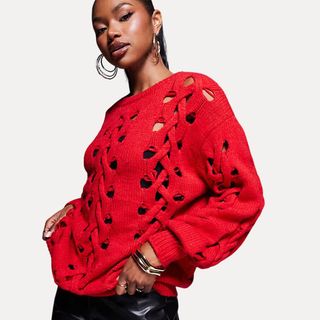 Balloon sleeve red jumper on model 