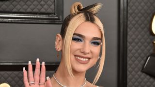 Dua Lipa is pictured with chunky, blonde face-framing hair highlights as she attends the 62nd Annual Grammy Awards at Staples Center on January 26, 2020 in Los Angeles, CA.