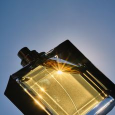 perfume bottle on a blue background