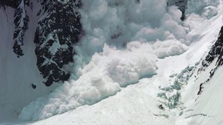 An avalanche crashes through the Savoia Pass on the northwest side of K2 in the Karakoram Range, Pakistan