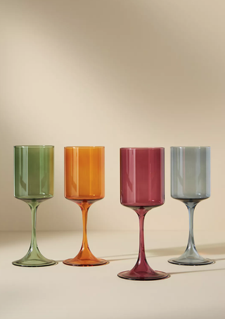 four colorful wine glasses