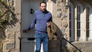 Liam looking horrified as he leaves his house