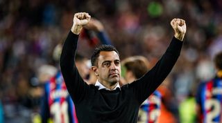 Xavi celebrates Barcelona's LaLiga title at Camp Nou in May 2023.